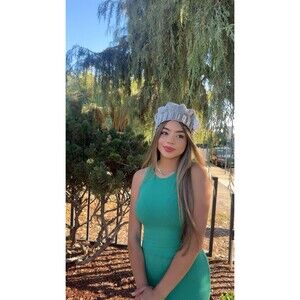 gray crochet beret with a white flower.